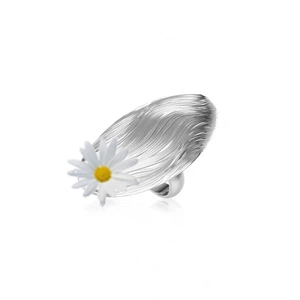 Irregular silver oval ring with brushed texture and small white daisy floral detail