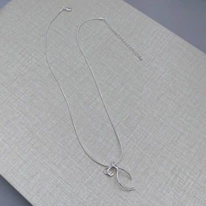Minimalist silver bow pendant necklace with sleek snake chain and lobster clasp closure
