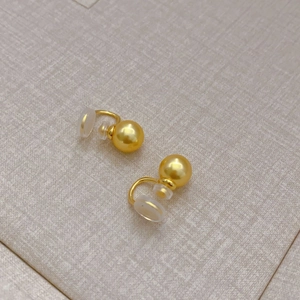 Golden clip-on earrings with 8mm pearls and silicone pads for non-pierced ears