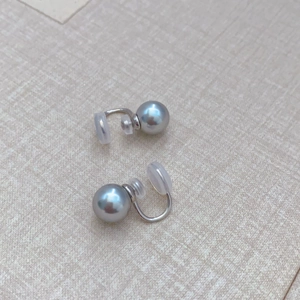 Fashionable grey pearl ear clips with silver U-shaped metal base and silicone pads