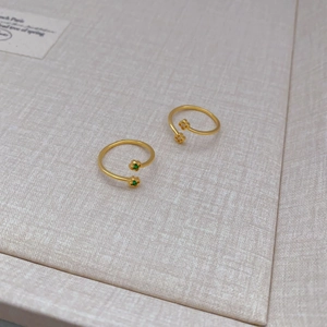 Adjustable gold plated flower ring set with emerald and clear zircon stones