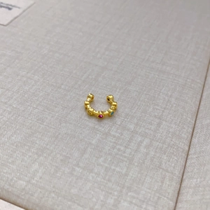 Gold plated ear cuff with colorful crystals in a non-pierced C-shaped minimalist design