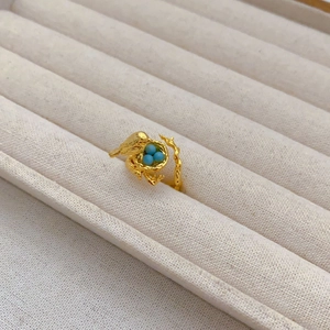 Creative adjustable golden bird nest ring featuring turquoise beads and nature theme