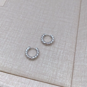 Silver twisted hoop earrings with a braided design and secure click-top closure for women