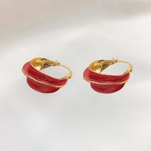 Red and gold irregular wavy hoop earrings with vintage enamel finish and 18k gold plating