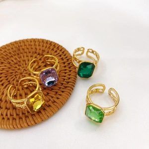 Set of four 18K gold plated adjustable rings with colorful square gemstones