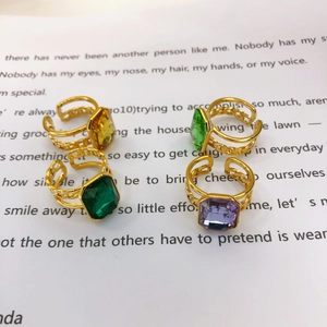 Set of four 18K gold plated adjustable rings with emerald cut colorful gemstones