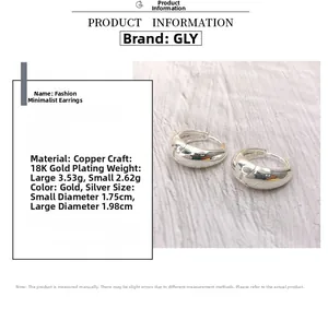 Detailed view of silver oval hoop earrings with exact size and material specifications