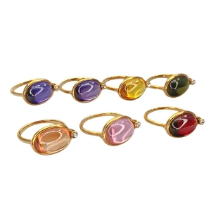 Set of seven oval cabochon gemstone rings in 18K gold plated finish with zircon accents