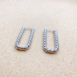 Elegant 18K gold plated rope twist rectangular hoop earrings for women on beige fabric