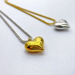Mixed gold and silver heart pendant necklace for women with high-polish metallic finish