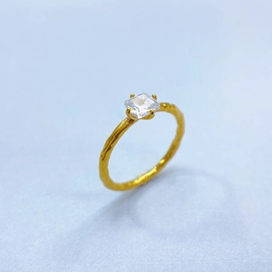 Detail of 18K gold plated hammered texture ring with square emerald-cut zircon stone