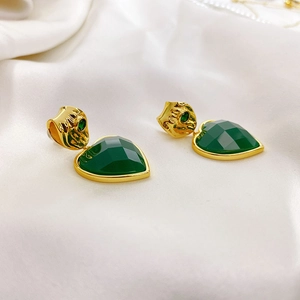 18K gold plated heart emerald drop earrings featuring textured metal on white silk