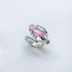 Detail of adjustable silver ring with pink crystal gemstone and floral bud design