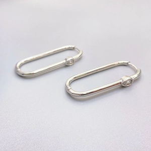 Silver oval hoop earrings with marquise-cut zircons in a minimalist geometric design