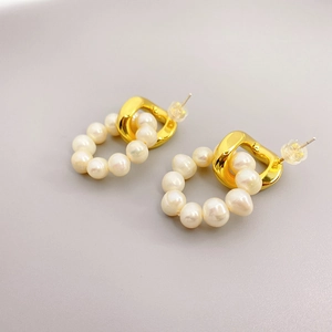 Fashionable 18K gold plated copper earrings with elegant pearls for a modern chic look