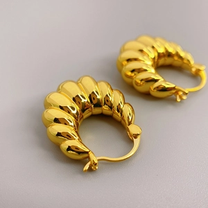 Polished 18K gold plated croissant hoop earrings with elegant ribbed spiral texture