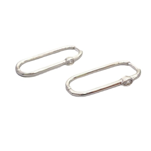 Polished silver U-shaped hoop earrings featuring a small sparkling zircon stone