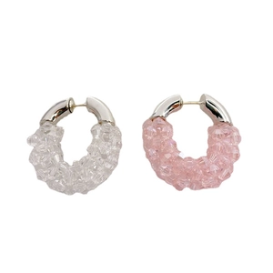 Exaggerated silver hoop earrings featuring clear and pink faceted crystal beads set