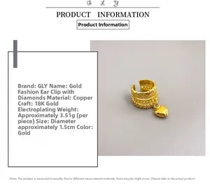 Detail view of 18K gold plated brass ear cuff with sparkling diamonds and heart pendant