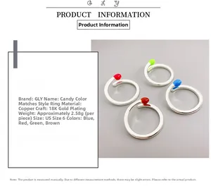 Detail view of 18K gold plated matchstick ring with colorful enamel tip options