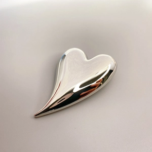Polished silver heart-shaped brass brooch with asymmetric 18K white gold plating