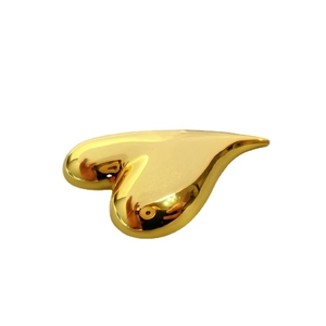 Polished 18K gold-plated brass heart-shaped brooch with glossy finish on white background