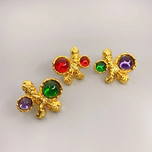 Vintage irregular gold studs with textured lava finish and colorful gemstone inlays