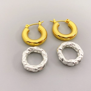 Two pairs of gold and silver brass hoop earrings with smooth and hammered textures
