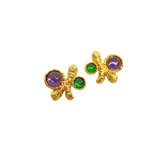 Irregular textured gold stud earrings with purple and green crystals in vintage style
