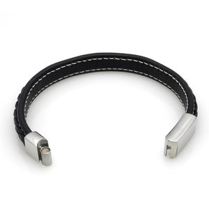 Detail of black woven leather bracelet featuring white stitching and silver magnetic clasp