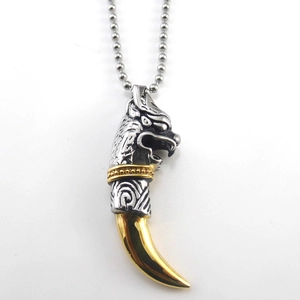 Wolf tooth pendant necklace in stainless steel with tribal style silver and gold finish