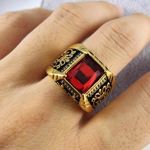 Vintage men's gold stainless steel ring featuring a large rectangular red ruby gemstone