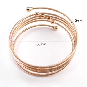 Detail view of rose gold coil bracelet with 2mm thickness and 58mm inner diameter