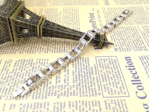 Silver stainless steel bike chain bracelet for men on vintage background decoration