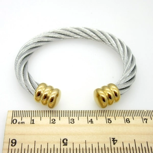 Top view of two-tone stainless steel cable cuff bracelet showing 60mm inner diameter measure