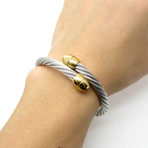 Adjustable two-tone cable twisted cuff bracelet with gold-plated bullet end caps