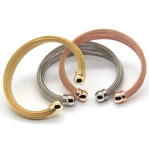Detailed view of woven mesh open bangles in gold, silver, and rose gold with polished ends