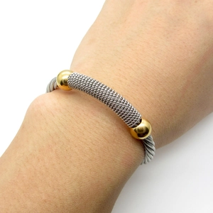 Two-tone silver and gold twisted cable open cuff bracelet with metallic ball accents
