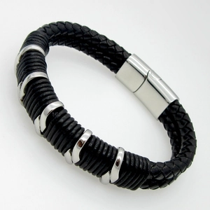 Close-up of double-layered black leather braided bracelet with magnetic steel clasp