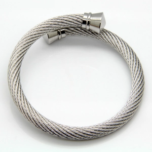 Macro shot of twisted stainless steel wire texture on adjustable silver cuff bracelet