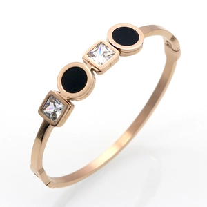 Rose gold stainless steel bangle with black rounds and square zircon geometric design
