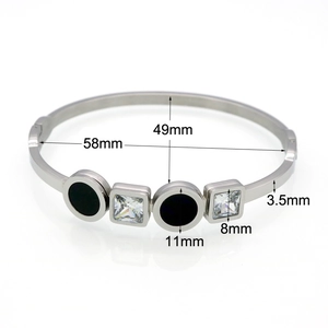 Silver stainless steel bangle with black round motifs and square crystals in 58mm size