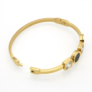 Golden titanium steel bangle with double square zircons and black circular enamel detail