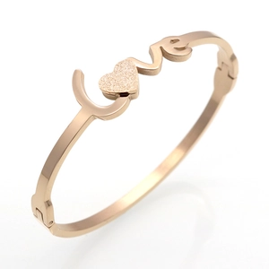 Rose gold LOVE bangle with matte heart detail and polished stainless steel finish