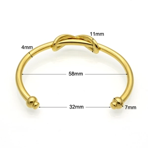Polished gold stainless steel knot cuff bracelet with 4mm band and ball end details