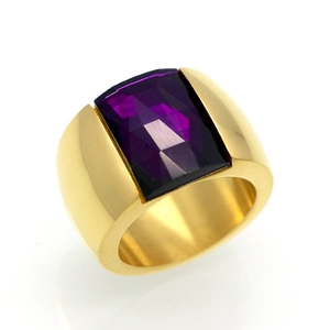 Macro shot of gold wide band ring with a rectangular faceted purple gemstone inlay