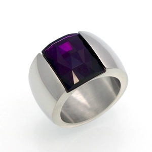 Macro view of a wide silver band ring featuring a vertical rectangular purple gemstone