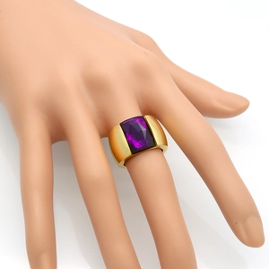 Polished gold titanium ring with a large rectangular purple gemstone for women