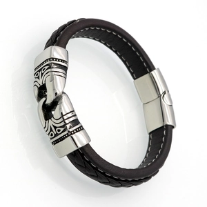 Men's dark brown leather bracelet with tribal relief steel clasp and white stitching